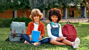 Two childrens with backpacks